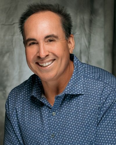 a professional photo of John Garcia, a local real estate expert in Huntington Beach, CA